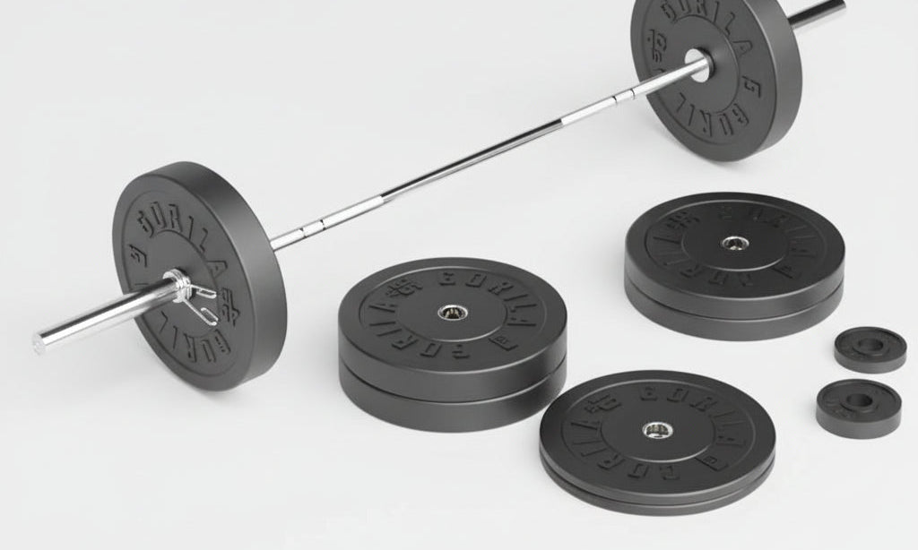 Gorila Fitness Olympic barbell loaded with plates, showing with precision knurling and needle bearings on a white floor