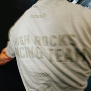 Person wearing a shirt with 'High Rocks Racing Team' text on the back
