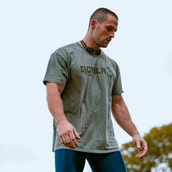 Wodapalooza Athlete from Team 911 wearing the Gorila Os Original Tee in Moss during an outdoor workout - Gorila Fitness