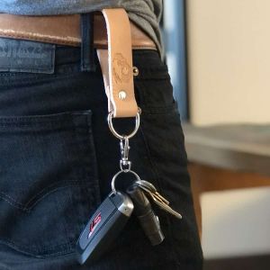 Gorila Fitness Leather Keychain showcased holding car keys.